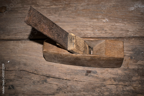 Old carpenter's brush on wooden planks photo