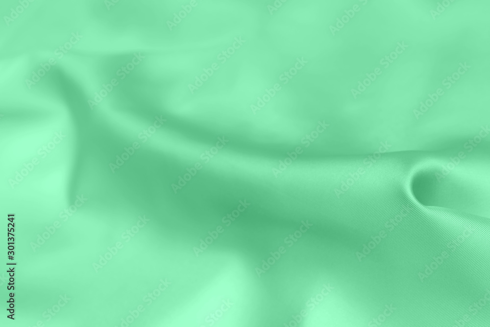 green satin fabric texture soft background green satin fabric texture soft background