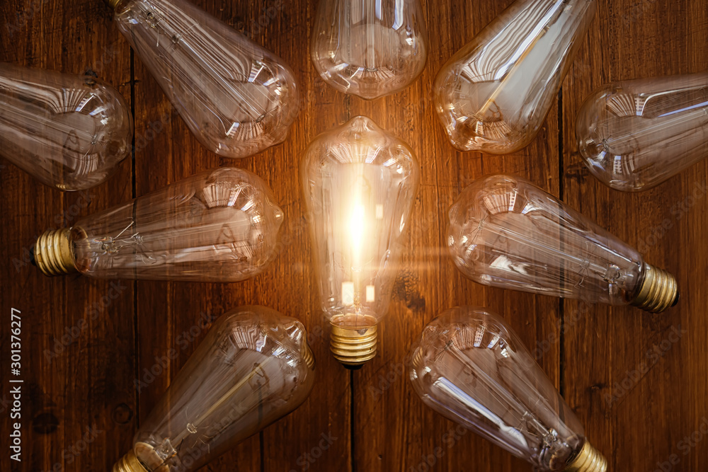 Glowing bulb. Idea, uniqueness, leadership and difference concept. - obrazy, fototapety, plakaty 