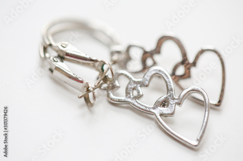 Three hearts in a line earrings. set of fashion earrings and decorations - Image