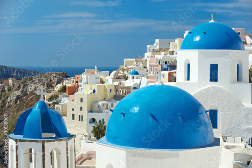 Canvas Print Bright scenic view of sky blue church domes dominating the frame in the Mediterr