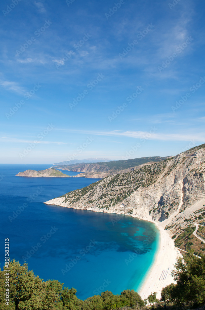 Fototapeta premium Bright scenic landscape view of Mediterranean Sea lapping at the white stone shore at Myrtos Beach, Kefalonia, Greece