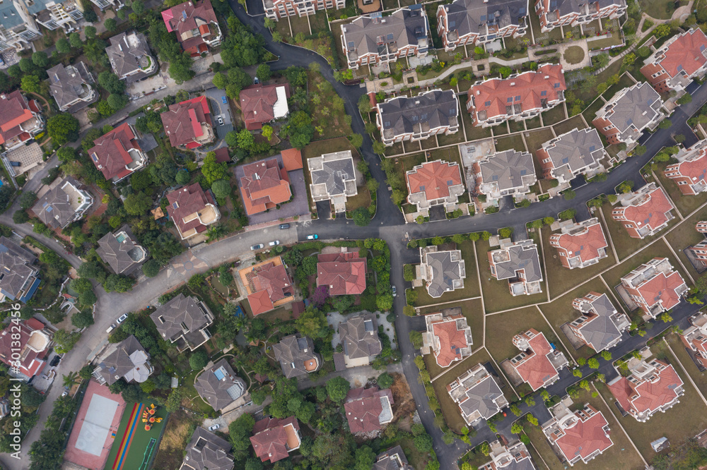 Aerial shot overlooking beautiful town residential colored roof top view Aerial shot overlooking beautiful town residential colored roof top view