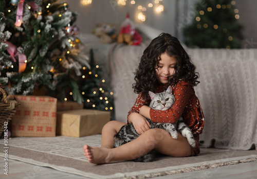 Canvas Print portrait of a little girl in studio decorated for christmas