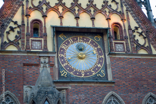 Close view of a part of the city hall in Wroclaw, Poland. Medieval town hall from a mixture of Gothic and Renaissance style. Astronomical clock on the city hall.