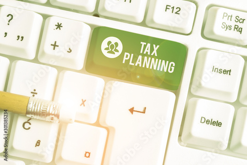 Handwriting text writing Tax Planning. Conceptual photo analysis of financial situation or plan from a tax perspective White pc keyboard with empty note paper above white background key copy space