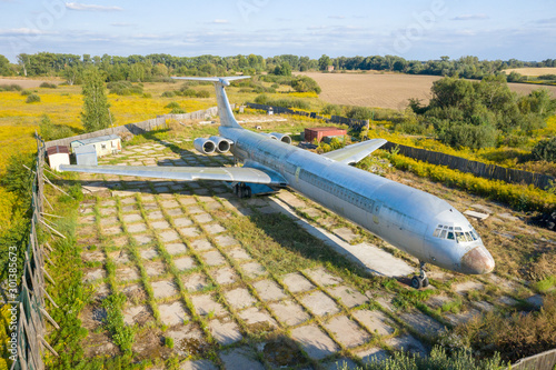 Wallpaper Mural Aerial drone top view photo of abandoned passenger air plane in old airport no longer used Torontodigital.ca
