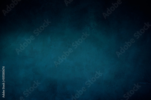 dark blue grungy background or texture with pastel hues