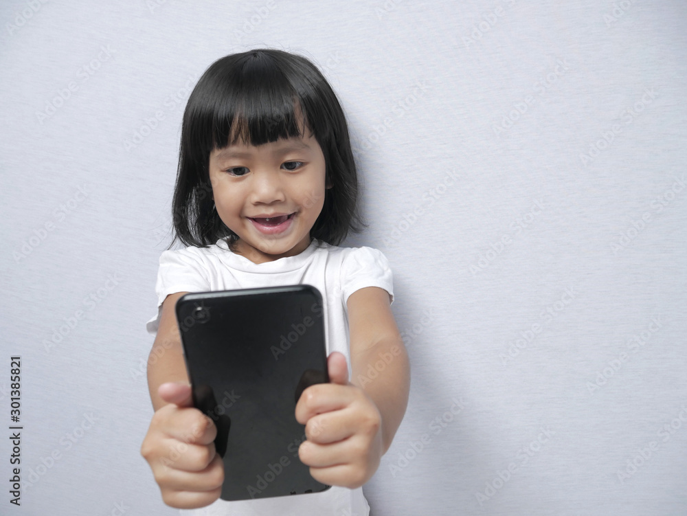 Little Girl With Smart Phone Gadget Little Girl With Smart Phone Gadget