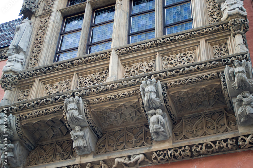 Fototapeta premium Decoration details of the city hall in Wroclaw, Poland. Part of the city hall building in the central square. Medieval architecture and a mix of Renaissance and Gothic styles in Poland.
