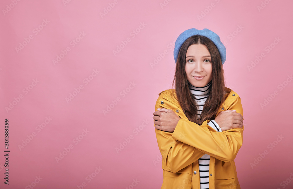 A cool girl with green eyes and pretty face in yellow raincoat trembling A cool girl with green eyes and pretty face in yellow raincoat trembling