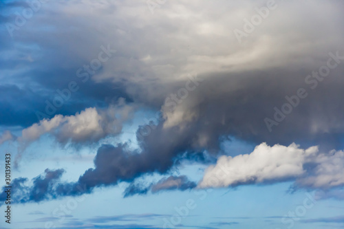 Beautiful thunderclouds. Fluffy volumetric clouds before a thunderstorm. Image without focus for design.