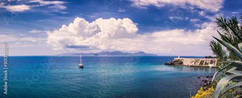 Cloudy Piombino (Tuscany) shore panorama with the island Elba in the distance © yMediaStock