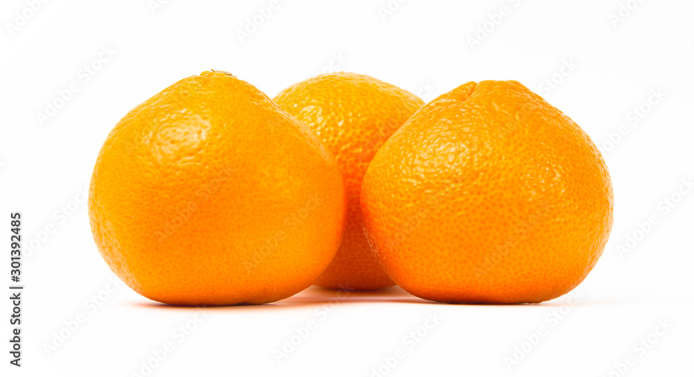 Ripe orange tangerines on a white background Ripe orange tangerines on a white background