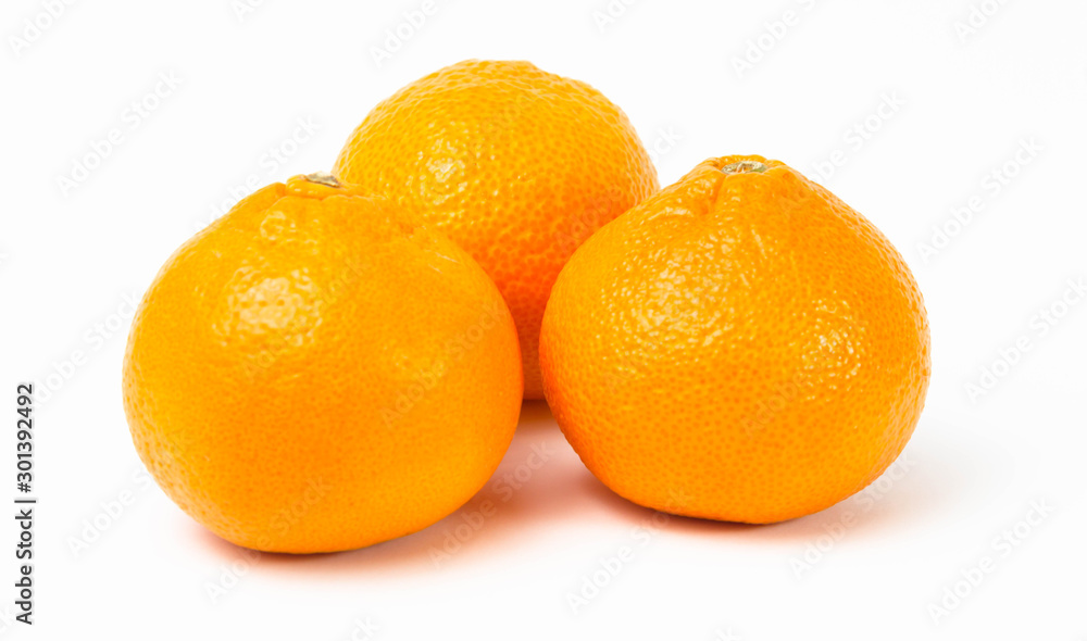 Ripe orange tangerines on a white background Ripe orange tangerines on a white background