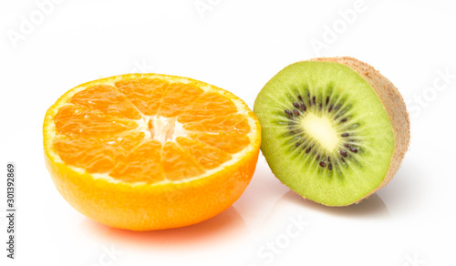 Orange mandarin and green kiwi on a white background