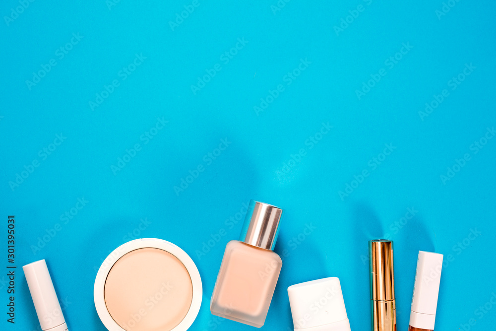 Cosmetics on a blue background. Top view. Text space. Cosmetics on a blue background. Top view. Text space.
