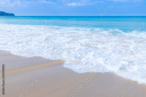 Fototapeta Naklejka Na Ścianę i Meble -  the sea wave splay white foam on the beach