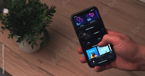 New York, New York City - November 6, 2019:  Using Spotify app on the smart phone. Shot on RED