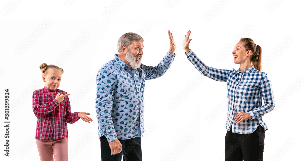 Family members arguing with one another on white studio background. Concept of human emotions, expression, conflict of generations. Woman, man and little girl. Too busy parents. Family members arguing with one another on white studio background. Concept of human emotions, expression, conflict of generations. Woman, man and little girl. Too busy parents.