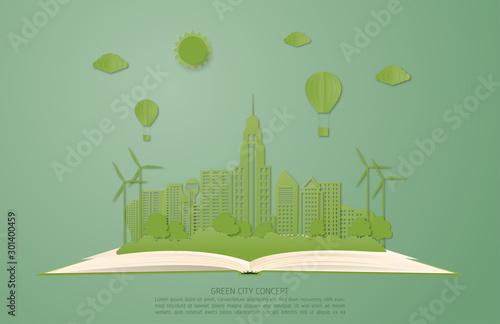 Ecology and environment conservation concept. Green city landscape on open book in paper cut style.