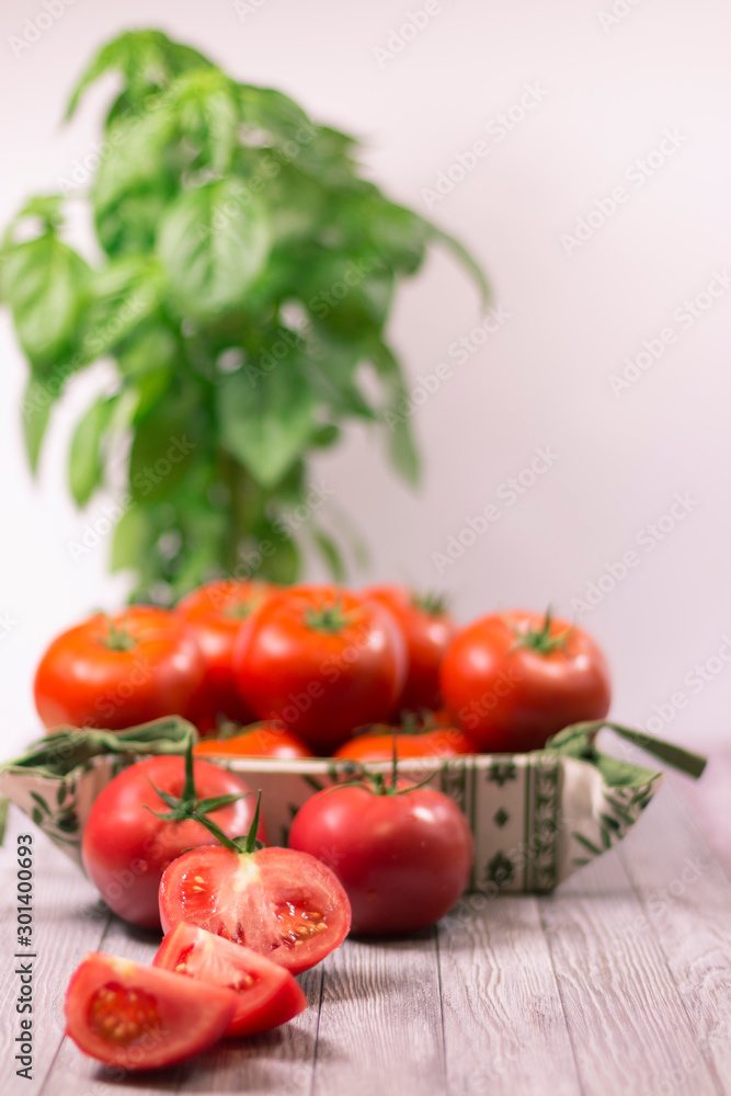 CHERY TOMATOES ON BOARDS WITH SPICES ON WHITE BACKGROUND CHERY TOMATOES ON BOARDS WITH SPICES ON WHITE BACKGROUND