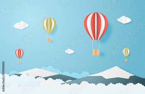 Love to travel concept. Origami made hot air balloon flying over mountain and clouds in the sky background. Vector illustration paper cut style. banner, poster, invitation card.