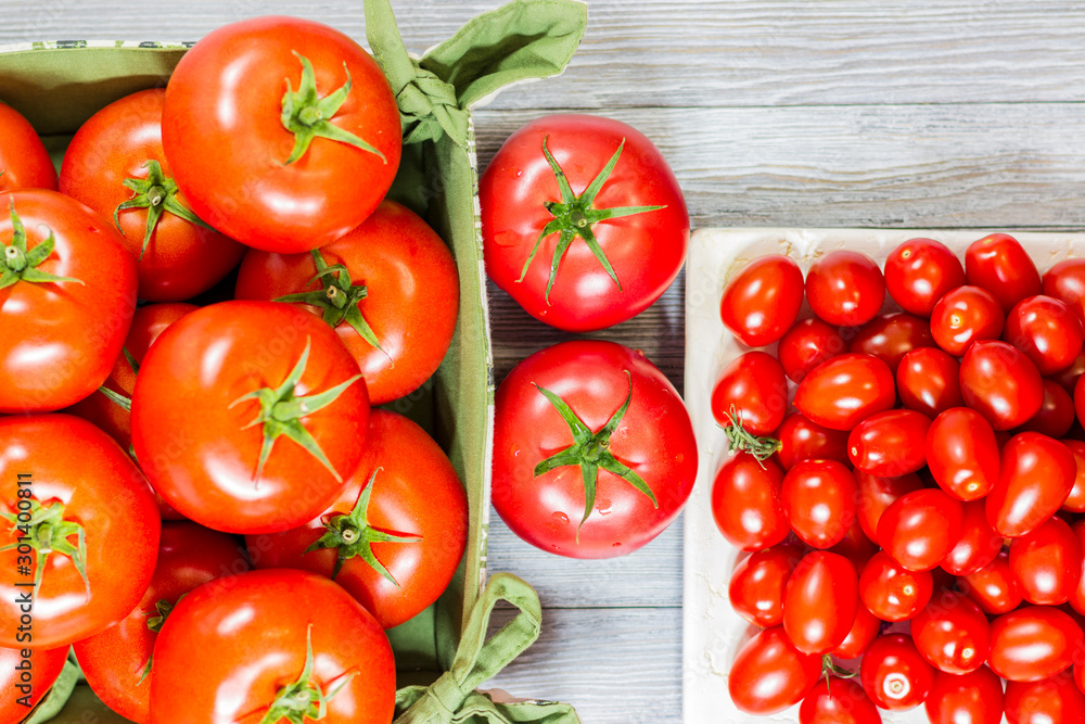 CHERY TOMATOES ON BOARDS WITH SPICES ON WHITE BACKGROUND CHERY TOMATOES ON BOARDS WITH SPICES ON WHITE BACKGROUND