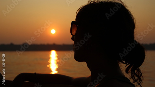 Puerto Maldonado »; August 2017: A girl on a sunset from the Madre de Dios River photo