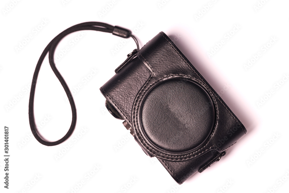 Classic compact camera in case isolated on white background Classic compact camera in case isolated on white background