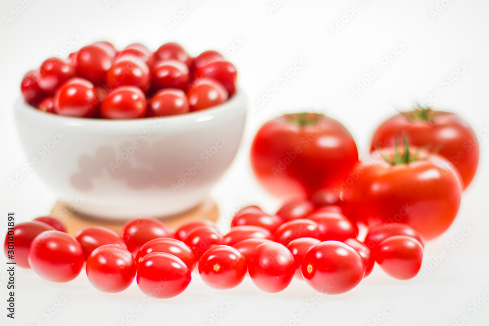 chery tomatoes on a white background with spices chery tomatoes on a white background with spices
