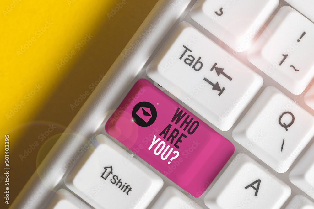 Obraz premium Text sign showing Who Are Youquestion. Business photo showcasing someone asking your demonstratingal background or history White pc keyboard with empty note paper above white background key copy space