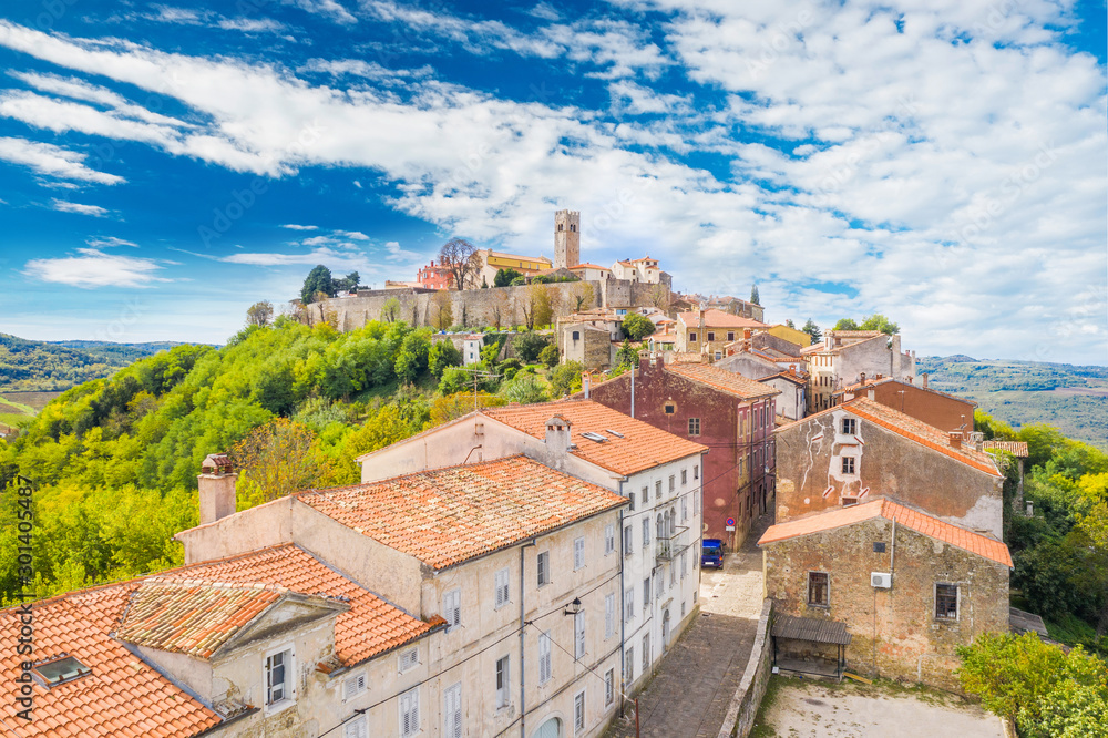 Town of Motovun in Istria, Croatia, old traditional houses and castle, view from drone