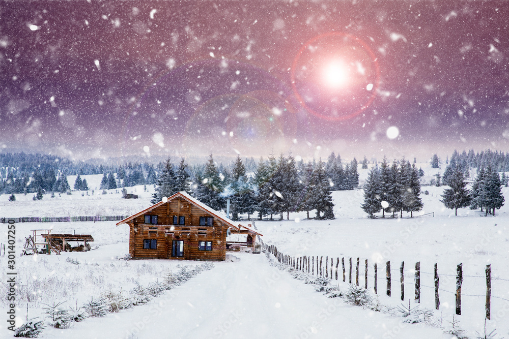 Wooden cottage in a fairy-tale winter landscape.