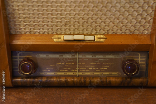 Photography of retro broadcast radio receiver. Listen music concept. Vintage instagram old style filtred photo. photo
