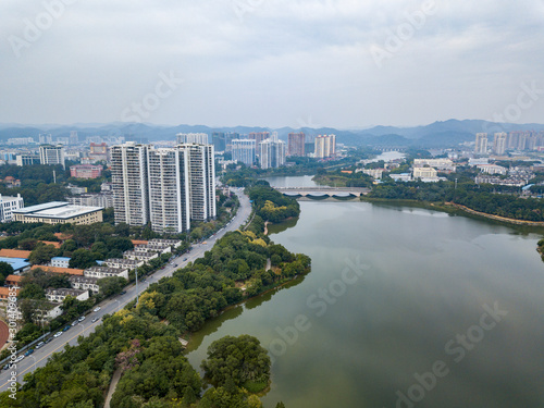 Aerial photos of leisure parks and tall buildings in urban inner lakes