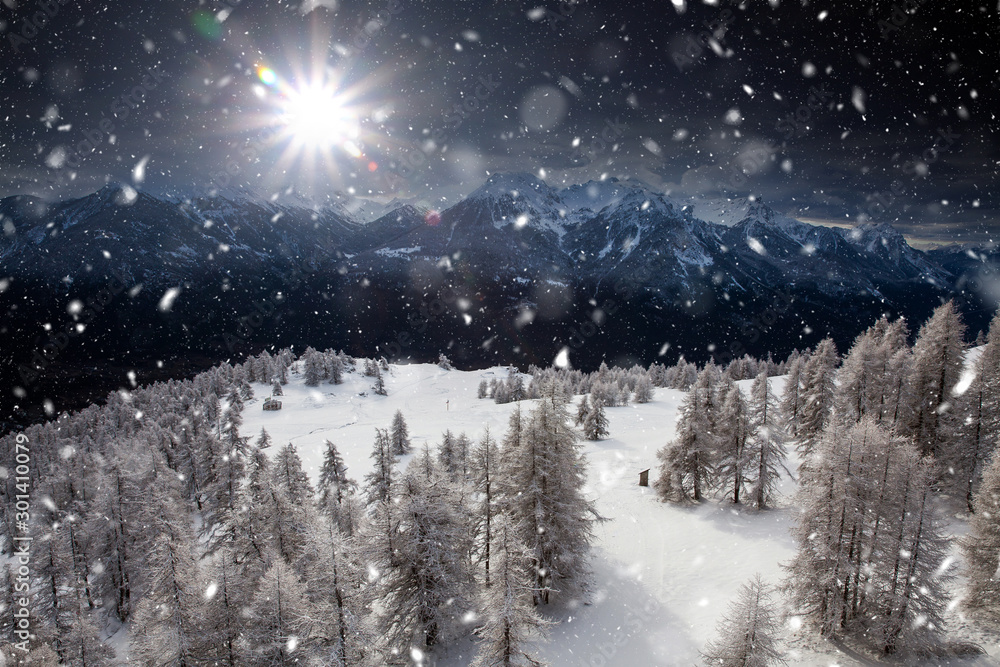 Christmas background with snowy fir trees and mountains in heavy blizzard. Christmas background with snowy fir trees and mountains in heavy blizzard.