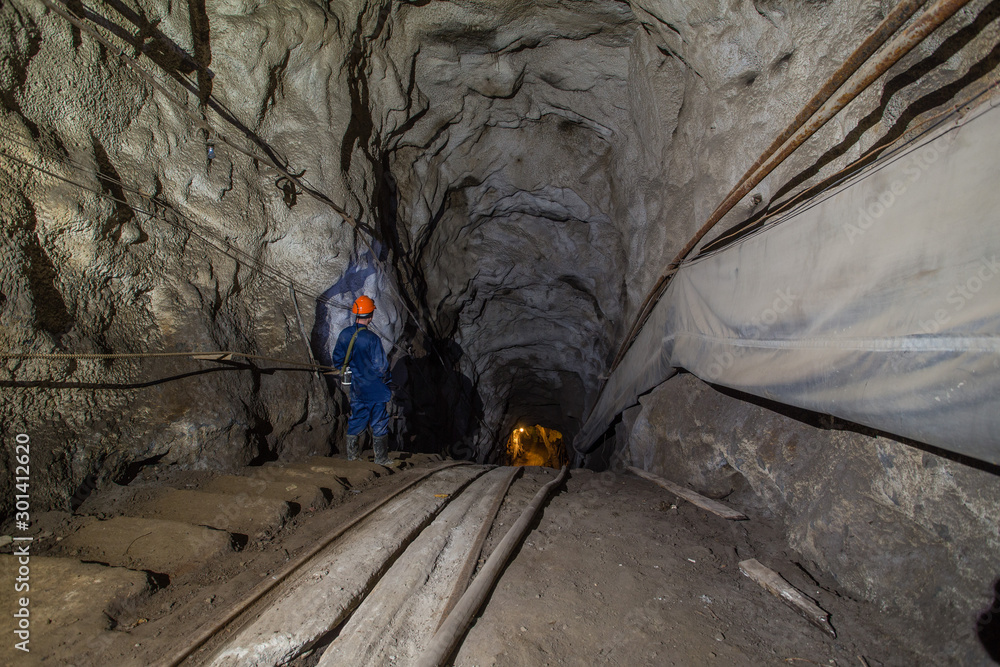 Gold iron mine ore shaft tunnel incline drift with rails underground