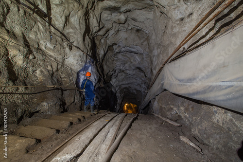 Gold iron mine ore shaft tunnel incline drift with rails underground © Mishainik
