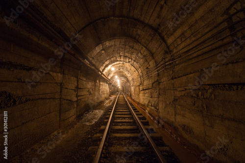 Gold iron mine ore shaft tunnel drift with rails underground