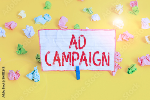 Conceptual hand writing showing Ad Campaign. Concept meaning an organized course of action to promote a product or service Colored crumpled paper empty reminder white floor clothespin © Artur
