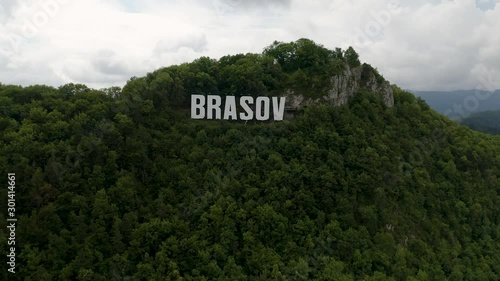 4K Brasov Romania Drone Rising Aerial Hollywood Sign Carpathian Mountains photo