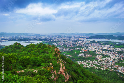 Top view of beautiful city of lakes, udaipur on the rainy day from sajjangarh fort, the top peak of the city build by king of rajasthan, India  © Peppygraphics