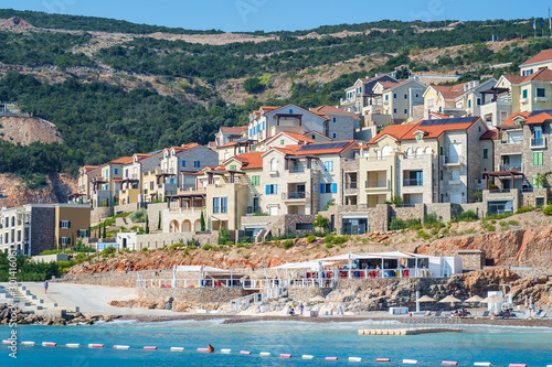 Shore and beach of a seaside town, view from the sea