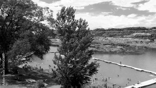 Black and white aerial view of Dierkes Park Lake with tourists in summer on a beautiful sunny day, Twin Falls, Idaho photo