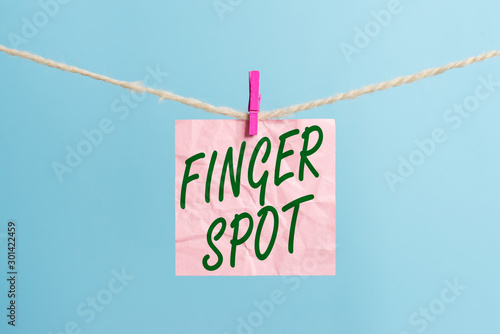 Text sign showing Finger Spot. Business photo showcasing Small fluidfilled blisters called vesicles appear on the finger Clothesline clothespin rectangle shaped paper reminder white wood desk photo