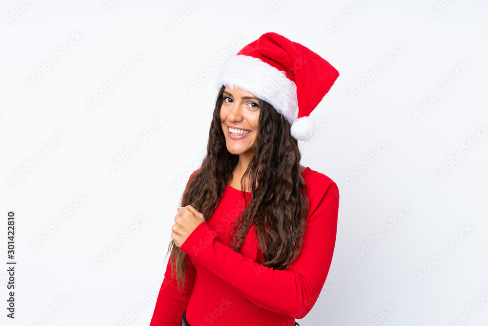 Girl with christmas hat over isolated white background celebrating a victory Girl with christmas hat over isolated white background celebrating a victory