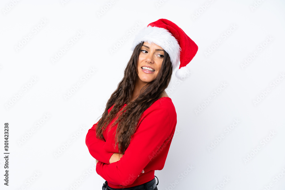 Girl with christmas hat over isolated white background laughing Girl with christmas hat over isolated white background laughing