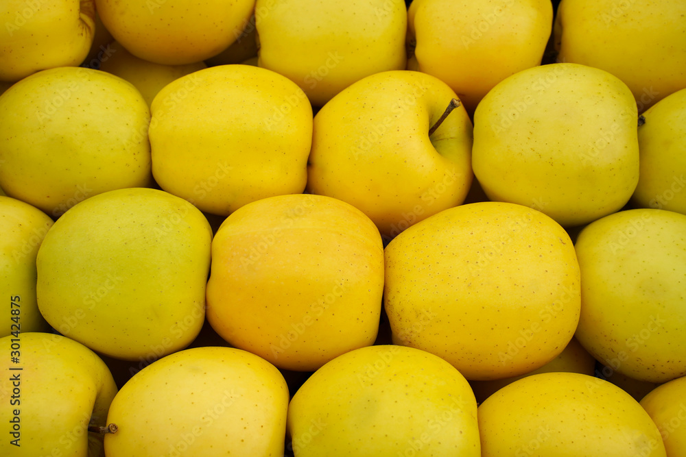 Fresh delicious apples in the store. Closeup. They lie in boxes in front of the buyer. Healthy food. Fresh delicious apples in the store. Closeup. They lie in boxes in front of the buyer. Healthy food.
