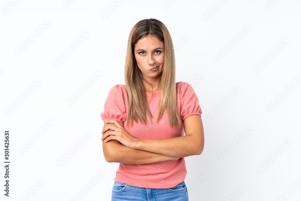 Young blonde woman over isolated white background feeling upset Young blonde woman over isolated white background feeling upset
